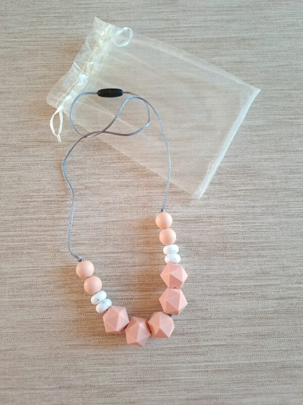 1-106 (1) Collier d'allaitement, de portage et de dentition