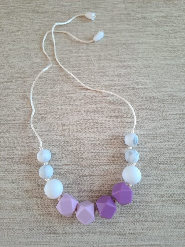 1-23 (2) Collier d'allaitement, de portage et de dentition.