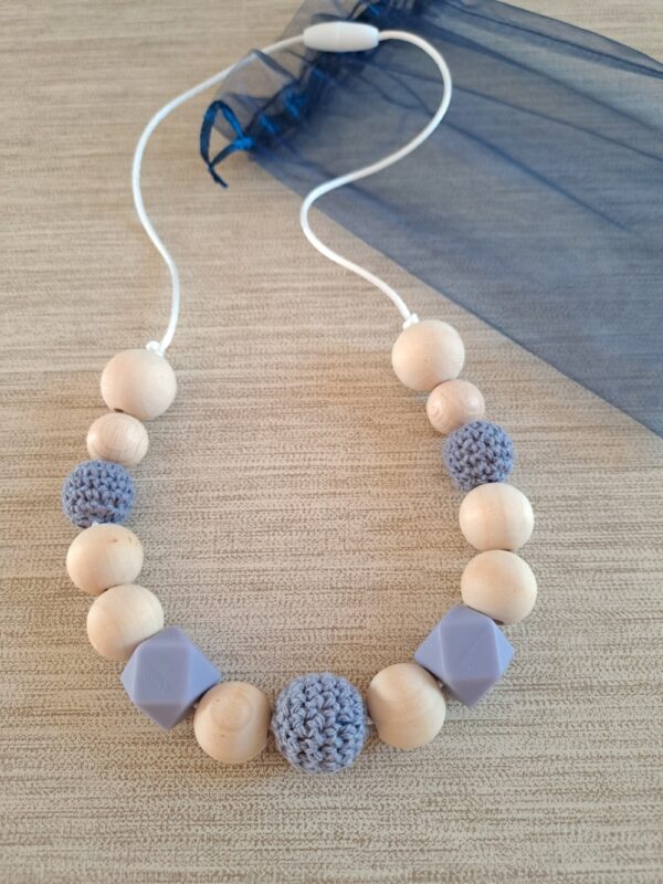 1-57 (2) Collier d'allaitement, de portage et de dentition.